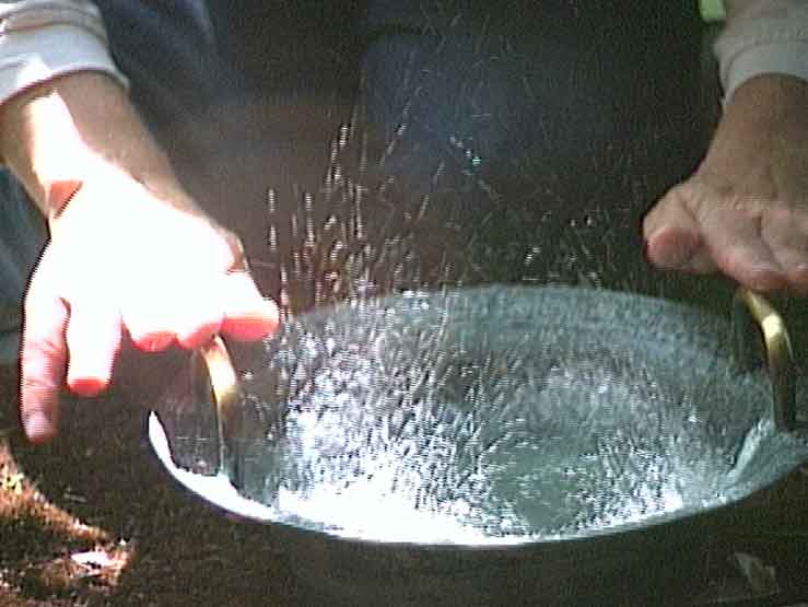 Rubbing the handles - notice the water jumping from the medium Spouting Bowl