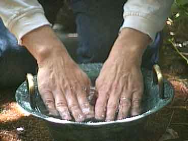 Dipping my hands in the water